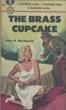 The Brass Cupcake. JOHN D. MACDONALD